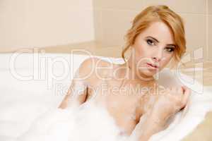 Woman in bath relaxing. Closeup of young woman in bathtub bathin