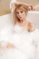 Woman in bath relaxing. Closeup of young woman in bathtub bathin