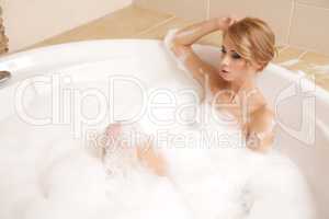 Woman in bath relaxing. Closeup of young woman in bathtub bathin