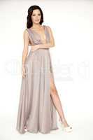 Young slim sexy woman in brown dress isolaten on white backgroun