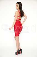 Young slim sexy woman in red dress isolaten on white background