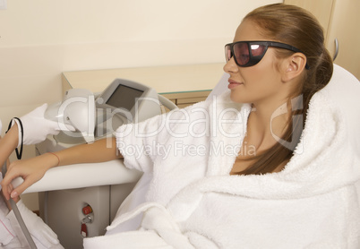 Young woman receiving laser therapy