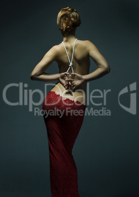 Young slim sexy woman in red dress