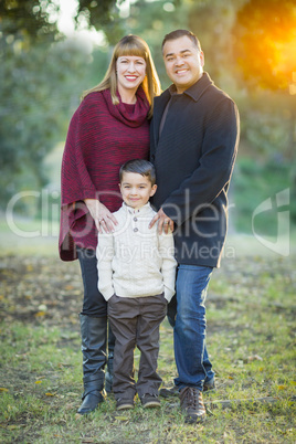 Young Mixed Race Family Portrait Outdoors