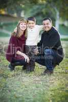 Young Mixed Race Family Portrait Outdoors