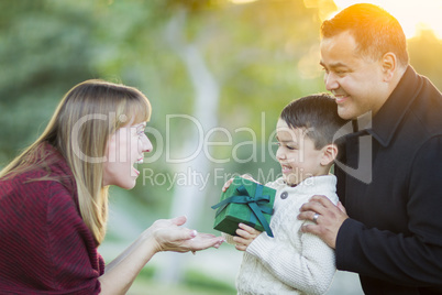 Young Mixed Race Son Handing Gift to His Mom