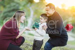 Young Mixed Race Son Handing Gift to His Mom