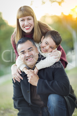 Young Mixed Race Family Portrait Outdoors