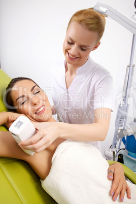 Young woman receiving laser therapy