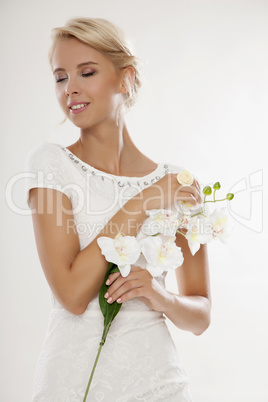 Young bride in white wedding dress happy smiling