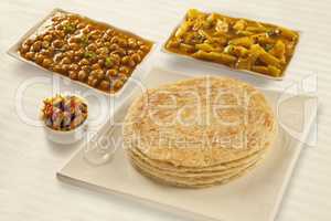 Puri paratha with chickpeas potato curry and pickels