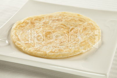 Golden fried paratha served on a hot plate