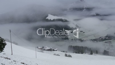 pan over foggy and snowy dolomites prags valley 11715