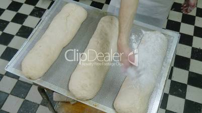german baker prepare and cut huge bread dough top view 11721