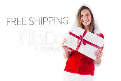 Composite image of pretty santa girl holding gift