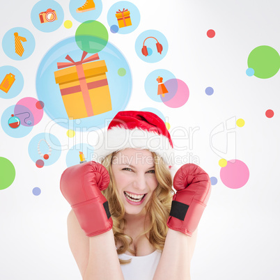 Composite image of blonde woman wearing boxing gloves smiling at