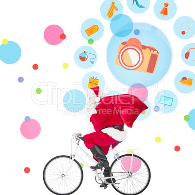 Composite image of santa claus delivering gifts with bicycle