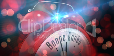 Composite image of bonne annee in red alarm clock