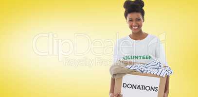 Composite image of smiling young woman with clothes donation
