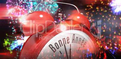 Composite image of bonne annee in red alarm clock