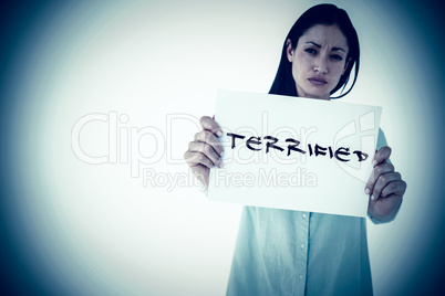 Composite image of sad woman showing sign