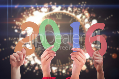 Composite image of hands showing 2016