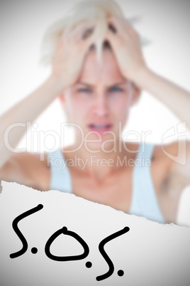 Composite image of sad blonde woman with head pain holding her h