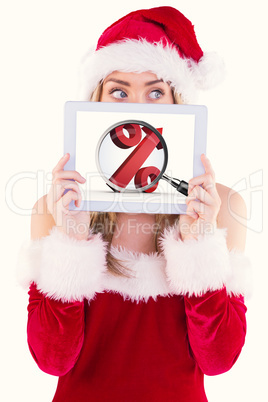 Composite image of pretty santa girl holding tablet