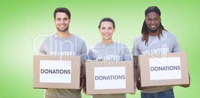 Composite image of happy volunteers with donation boxes in park