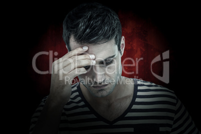 Composite image of close up of sad hipster with one hand on head