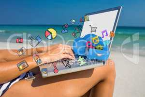 Composite image of woman using laptop on deck chair
