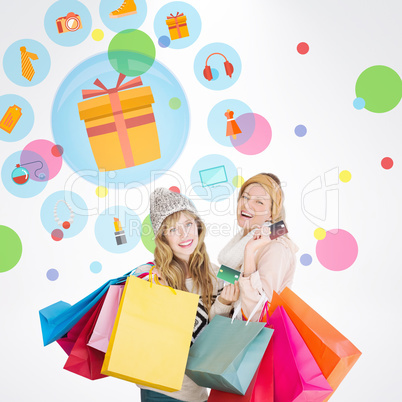 Composite image of beautiful women holding shopping bags looking