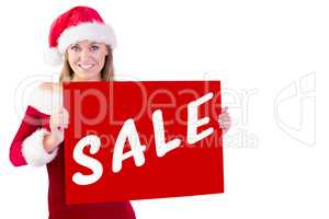 Composite image of festive blonde smiling at camera holding post