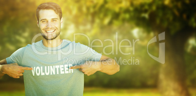 Composite image of happy volunteer in the park