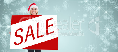 Composite image of festive blonde showing poster