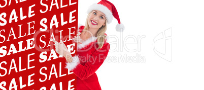 Composite image of festive blonde showing white card