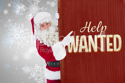 Composite image of smiling santa claus pointing poster