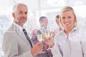 Composite image of business team celebrating with champagne and