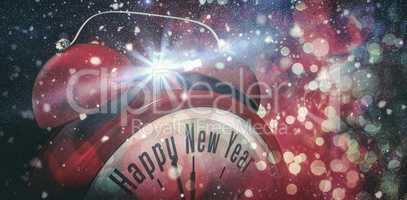 Composite image of happy new year in red alarm clock