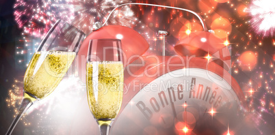 Composite image of champagne glasses clinking