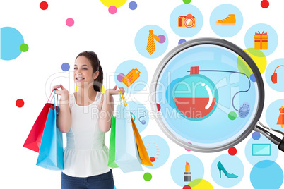 Composite image of happy brunette posing with shopping bags