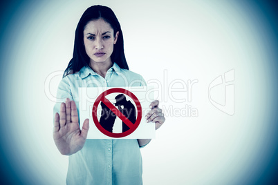 Composite image of woman showing card and saying stop