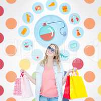 Composite image of woman holding some shopping bags