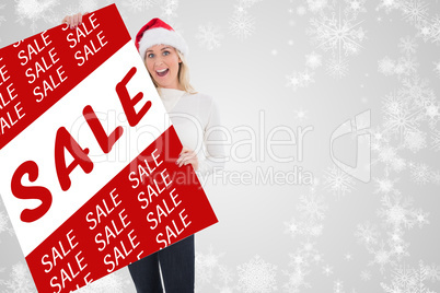 Composite image of festive blonde showing poster