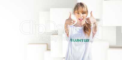Composite image of natural blonde wearing a volunteering t shirt