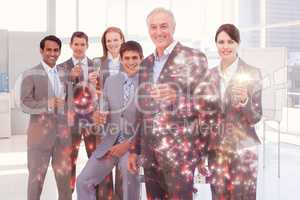 Composite image of business people toasting with champagne