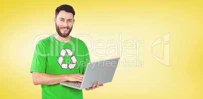 Composite image of portrait of man working on laptop in office