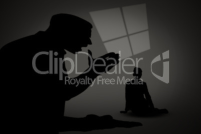 Composite image of silhouette of businesswoman sitting