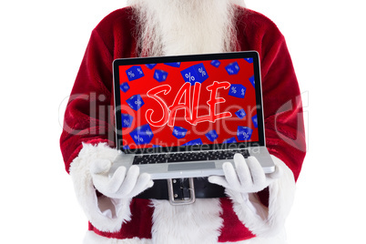 Composite image of santa claus presents a laptop