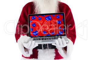 Composite image of santa claus presents a laptop